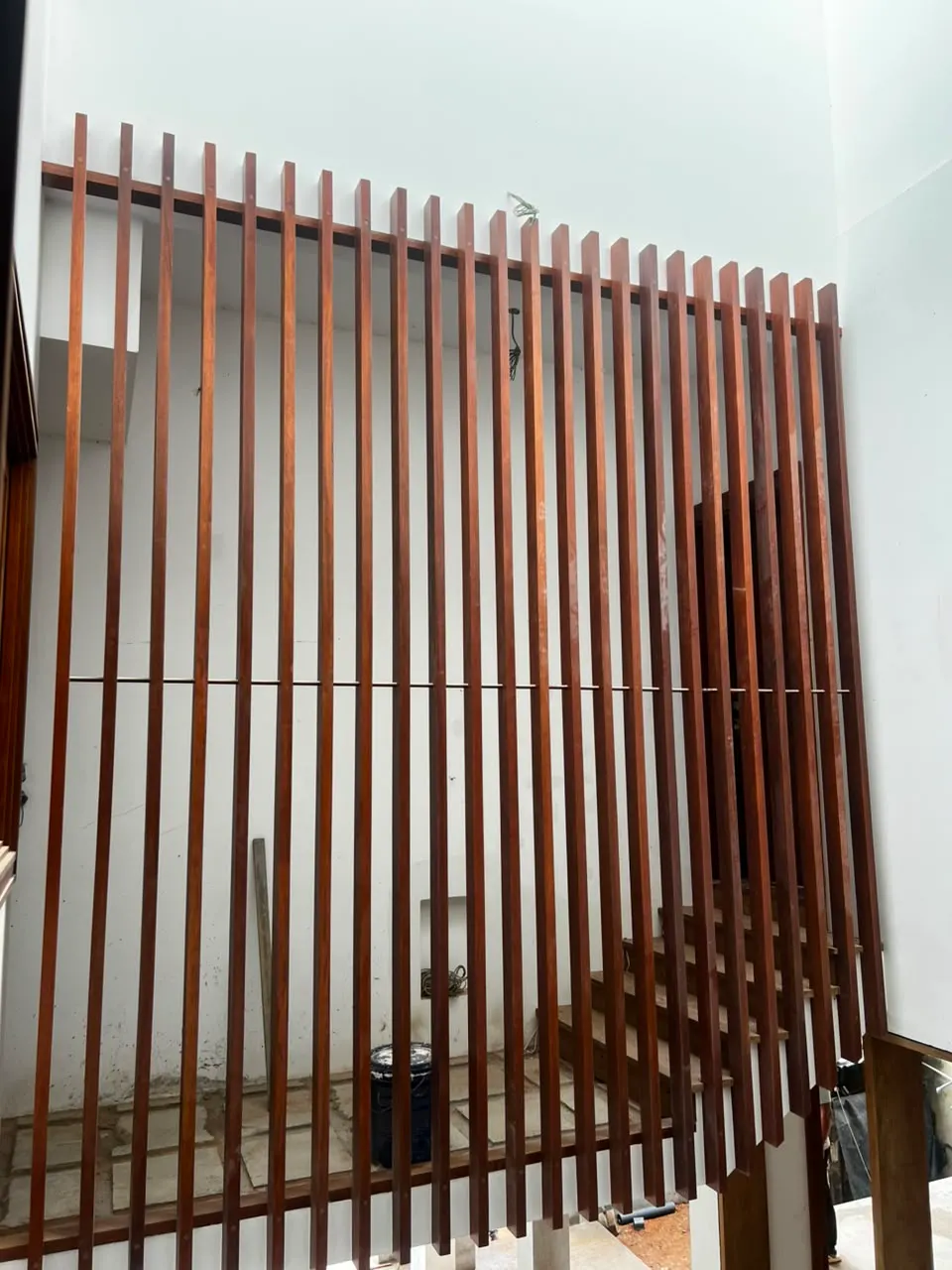 Rosmead Place under construction: a double-height space screened by vertical battens
