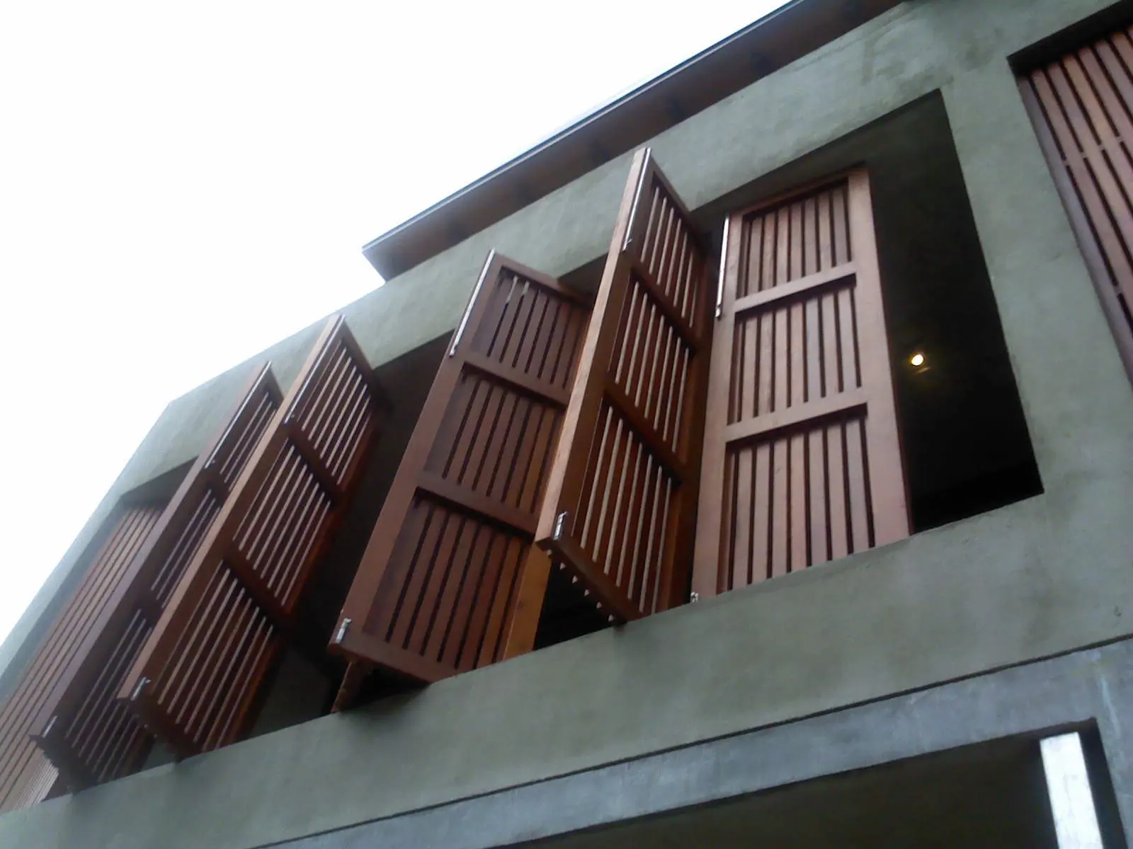 Shutters folded open, seen from below.